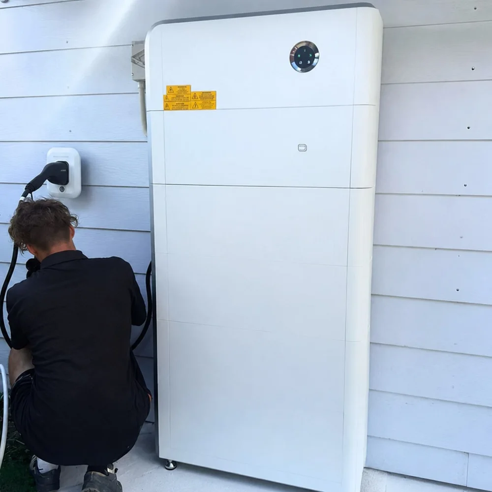 A Solar Batteries Melbourne team member wiring an electric vehicle charger to a newly installed home solar battery
