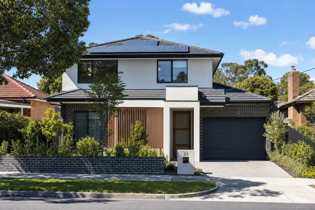 Solar battery system installed on a Box Hill post-war brick home with rooftop solar and eastern Melbourne backdrop