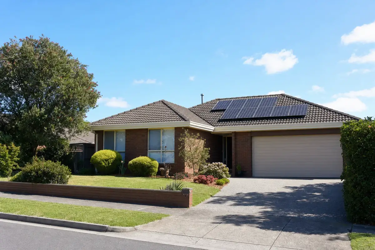 Solar battery and inverter in the double garage of a Glen Waverley family home, paired with a large rooftop solar array covering both the front and rear roof slopes